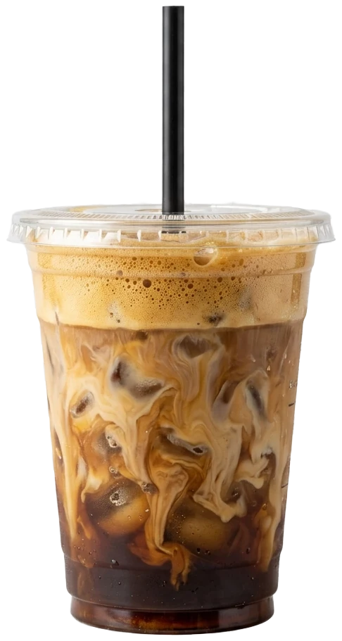 Brown sugar shaken espresso in a clear cup, oat milk swirling through the foamy espresso