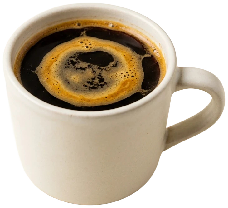 Red eye in a warm-white mug, a ring of crema floating on dark coffee